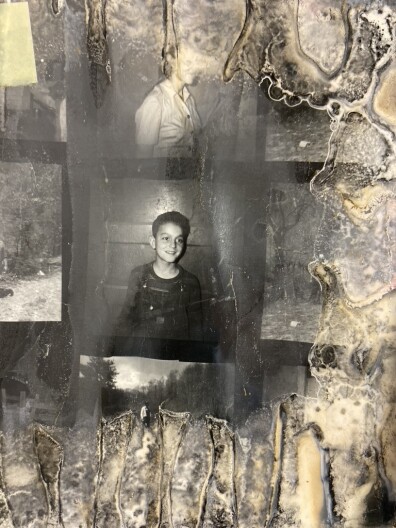 A black and white page shows pictures of a women and a boy. The page is archival material from Appalshop in Whitesburg, Kentucky, badly damaged after flooding in 2022.